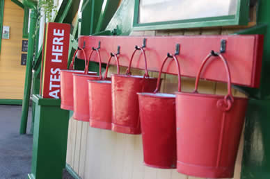 Red Fire Buckets at the Station