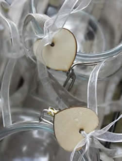 simple wooden heart shapes tied with transparent white ribbon bows