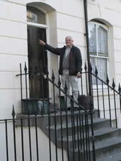 John pointing to the front door of the house in  Arundel Square where his mother lived