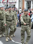 Members of the armed forces parade through the High Street Odiham