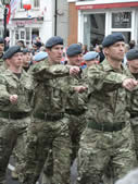 Members of the armed forces march past 