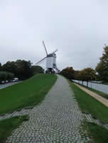 Brugge One of the four remaining windmills.   The Gent to Ostende canal to the right